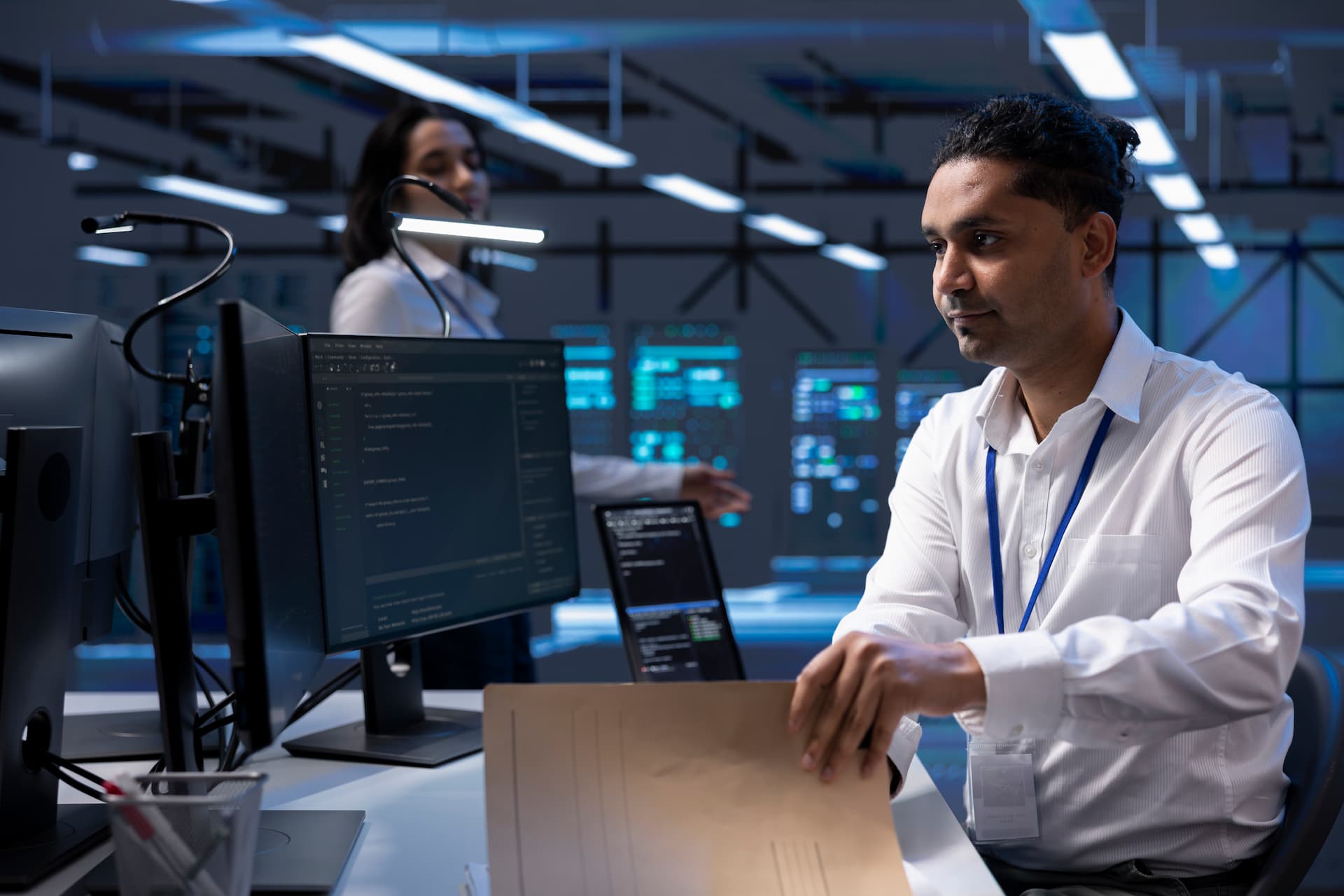 Engineer in a server room checking compliance